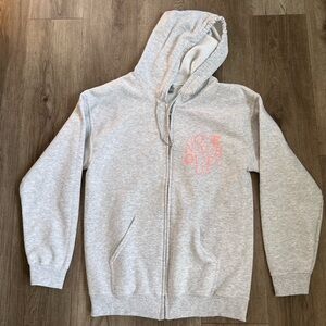 HWLF zip up hoodie. Ash gray. Pink lettering (“Love never gives up”).